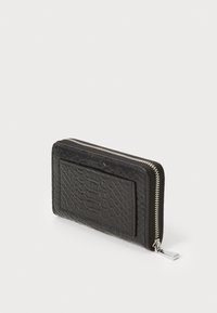 Black wallet made of textured synthetic material, featuring a zip closure, a card slot on the front, and a sleek rectangular shape.