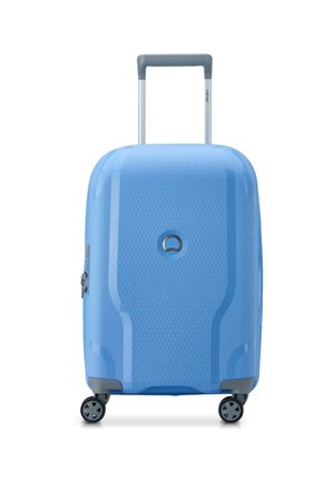 Blue hard-shell suitcase with textured surface, retractable handle, and four wheels. Features a circular logo and silver zipper accents.