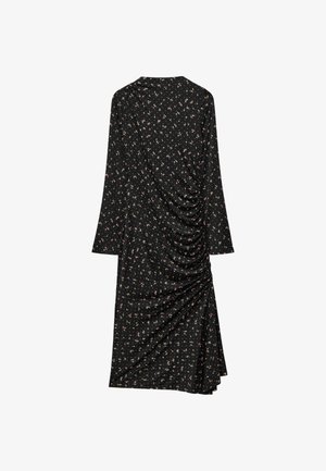 Schwarzes Blumenkleid mit langen Ärmeln. Merkmale ein gerafftes Seitendesign, weichen Stoff und einen kleinen pinken und weißen Blumenprint.