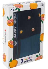 Verpakking met twee shorts, waaronder een donkerblauwe short met fruitprints en een effen turquoise short. De doos heeft een fruitthema ontwerp en een maatlabel.