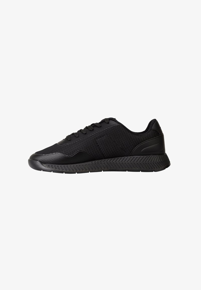 Black athletic sneaker with textured mesh upper, lace-up closure, and patterned rubber sole shown in side profile against white background.