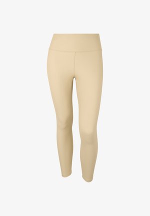 Leggings beige hechos de una tela elástica, con una cintura alta y una textura suave, diseñados para la comodidad y la flexibilidad.