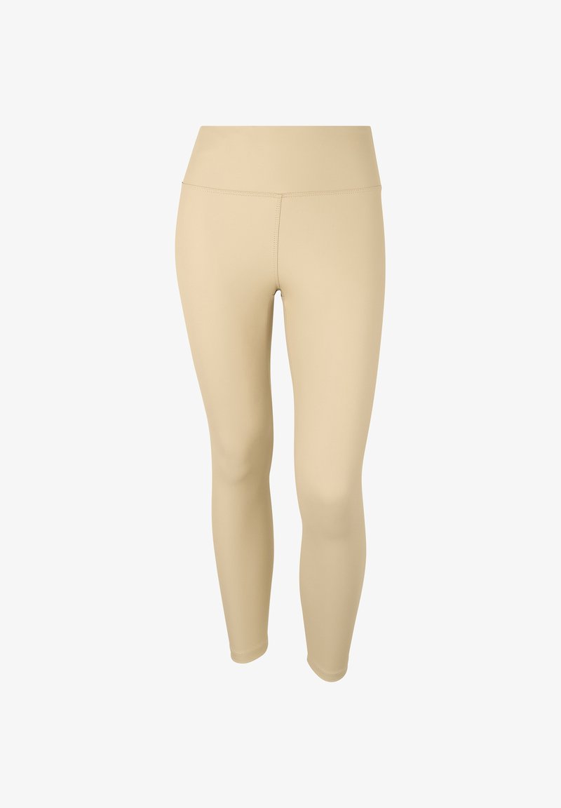 Leggings beige realizzati in un tessuto elasticizzato, con un alto punto vita e una texture liscia, progettati per comfort e flessibilità.
