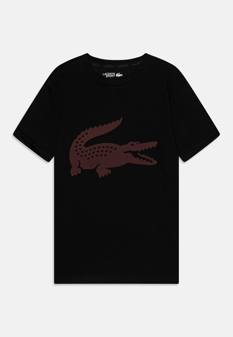 T-shirt noir à manches courtes avec un grand motif stylisé de crocodile marron centré sur le devant et une étiquette Lacoste Sport à l'intérieur du col.