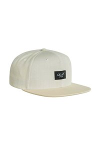 Beige Snapback-Cap aus strukturiertem Stoff, mit einem flachen Schirm und einem schwarzen rechteckigen Etikett auf der Vorderseite.