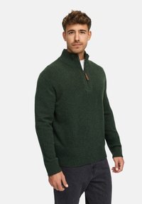 Donkergroen pullover trui met een hoge kraag en een halve rits. Gemaakt van gestructureerde stof, met ribgebreide manchetten en zoomdetails.