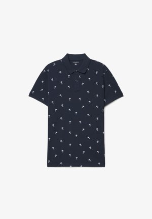 Polo a maniche corte blu navy con piccoli motivi di palme bianche, colletto con bottoni ed etichetta taglia XL all'interno del collo.