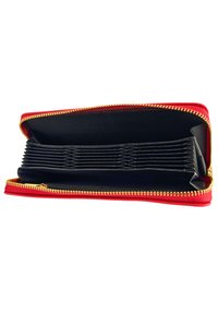 Red zippered wallet with a black interior, featuring multiple organized compartments and a gold zipper. Smooth texture, rectangular shape.