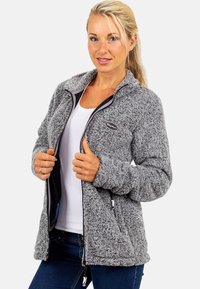Gray fleece jacket with a high collar, zippered front, and side pockets. Soft texture, featuring a logo on the chest and contrast trim.