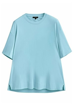 T-shirt oversize bleu clair à manches courtes, col rond et fentes latérales à l'ourlet.