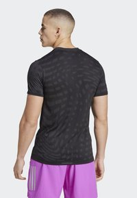 adidas Performance GYM SEAMLESS - Sportovní tričko - black   grey six