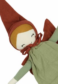 Soft doll with a peach face, red pointed hat, green dress, and long arms. Features stitched eyes and a brown yarn hair accent.