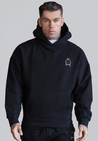 Felpa con cappuccio nera in misto cotone, con tasca frontale e logo ricamato in oro sul lato sinistro del petto. Vestibilità classica e rilassata.