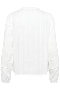 Vit blus med en texturerad design med vertikala ränder och ögla detaljer på ärmarna. Flödande, avslappnad passform med långa ärmar.