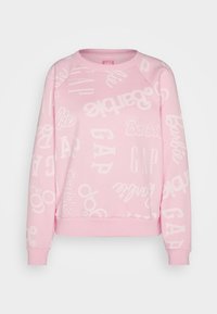 Felpa rosa chiaro con vari loghi e testi, tra cui "Barbie" e "GAP", in una tipografia bianca giocosa sparsa su tutta la stoffa.