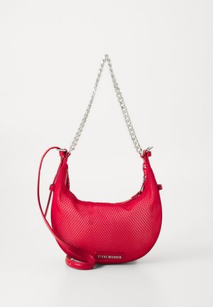 Red mesh handbag with a curved shape, silver chain details, and an adjustable strap. Features a branding insignia on the front.