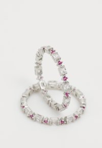 Silver-tone rings featuring alternating clear rectangular and round pink accents, with a polished finish and geometric design.