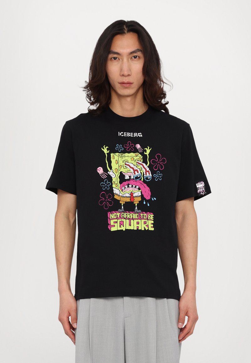 Black t-shirt featuring a colorful graphic of SpongeBob SquarePants with the text "NOT AFRAID TO BE SQUARE." Relaxed fit, short sleeves.