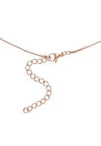 Roségull-tonet metallhalskjede med en delikat kjede og en krabbehekte. Har en serie runde lenker for justerbar lengde.