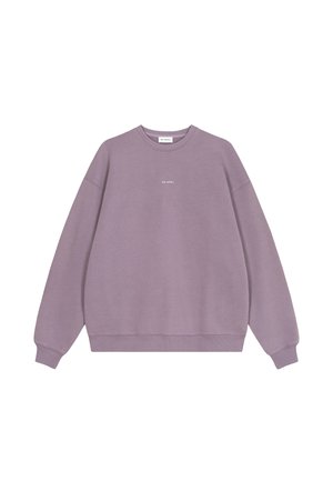Lilla crewneck sweatshirt med ribkanter ved ærmer og kant, med lille hvid "OH APRIL" tekst centreret på brystet.