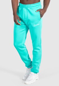 Smilodox CASUAL SLIM FIT KANE - Träningsbyxor - türkis