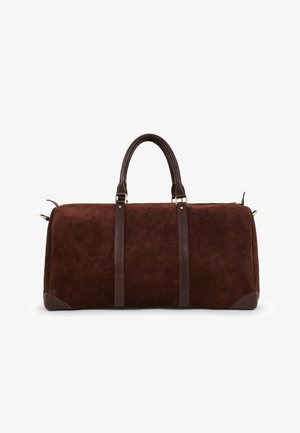 Brown suede duffel bag with dark brown leather accents, dual handles, and gold-tone hardware. Rectangular shape with rounded edges.