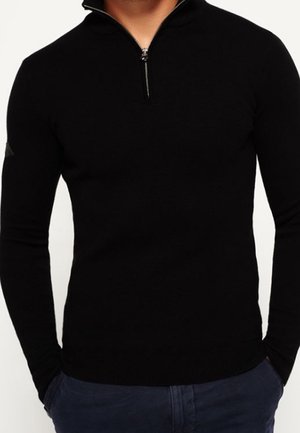 Stickad tröja - black