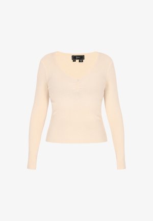 Kreemivärvi pikad varrukad ribatud topp, millel on V-kaelus ja kerge volang keskosas. Valmistatud pehmest, tekstureeritud kangast. Suurus väike.