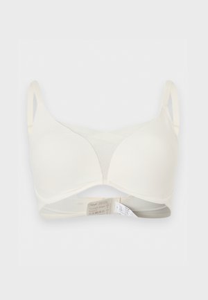 Φόρμα σουτιέν σε εκρού χρώμα με ρυθμιζόμενους ιμάντες και λείο, αόρατο σχέδιο, που βρίσκεται επίπεδα σε λευκό φόντο.