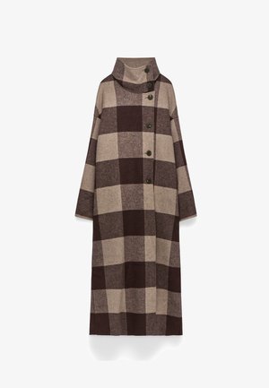 Lång tunika i ullblandning med brun- och beige-rutigt mönster, med hög krage och fem knappar fram. Generös passform och ärmar.