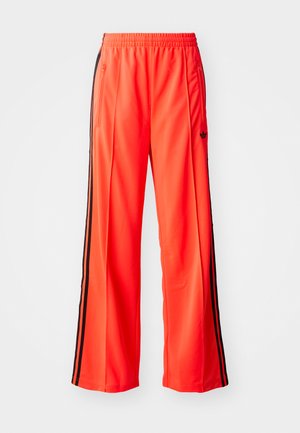 adidas Originals FIREBIRD - Verryttelyhousut - lucid red/black