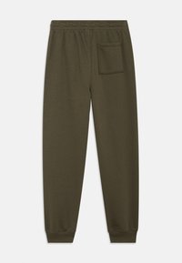 Παντελόνι φόρμας ελιάς με ελαστική μέση, μανσέτες στον αστράγαλο και μια μόνο τσέπη με πάτο στη δεξιά πίσω πλευρά.