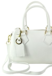 White leather handbag with textured finish, dual top handles, detachable shoulder strap, gold-tone hardware, and a zip closure.