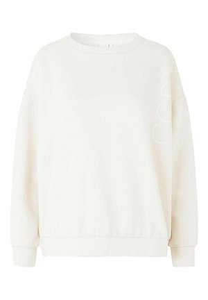 Sweatshirt blanc à coupe ample, col rond et poignets côtelés. Présente un branding subtil à l'avant dans une teinte similaire. Texture douce.