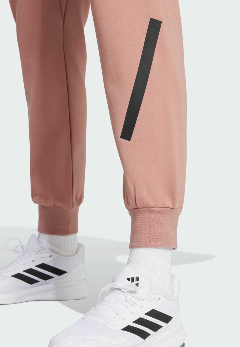 adidas Sportswear Z.N.E. - Tracksuit bottoms - warm clay/light brown -  Zalando.co.uk