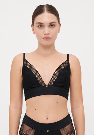 Soutien-gorge noir avec un décolleté en V profond, des détails en mesh et des bretelles réglables. Texture lisse avec un petit accent décoratif au centre.