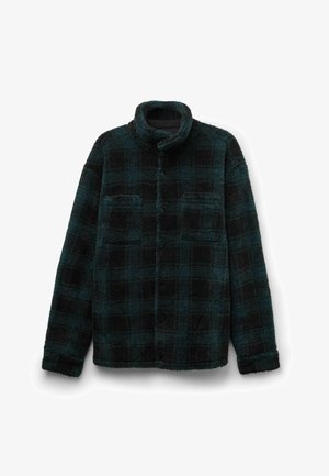 Zwarte en teal geblokte fleecejas met een opstaande kraag en twee voorzakken; zachte textuur en lose fit.