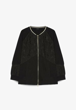 Schwarze Jacke mit Reißverschluss, Blumenstickerei auf dem vorderen Teil und den Ärmeln, gerippte Bündchen und kontrastierende Einfassung am Kragen.