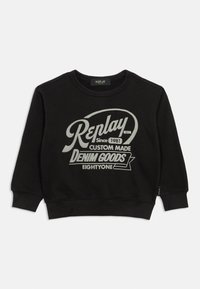 Felpa nera realizzata in tessuto misto cotone con colletto rotondo. Presenta un testo grafico argentato: "Replay Since 1981 Custom Made Denim Goods Eightyone."