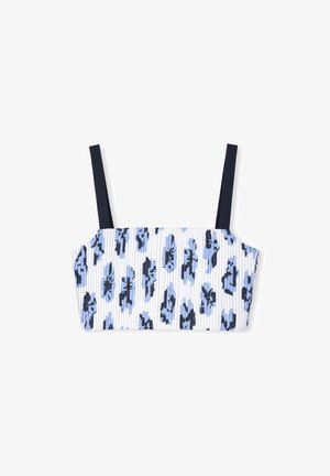 Top court à côtes avec une base blanche et un motif floral bleu, présentant des bretelles fines bleu marine et une forme structurée. Le tissu semble doux.