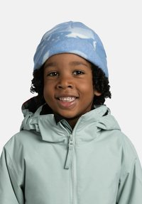 Light blue fleece beanie with cloud pattern. Child wearing a mint green zip-up jacket with hood, featuring a black accent on the collar.