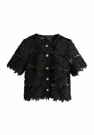 Melnas ziedu mežģīņu krekls ar īsām piedurknēm, apaļu izgriezumu un zelta pogām centrā. Visu virsmu rotā smalki ziedu raksti.