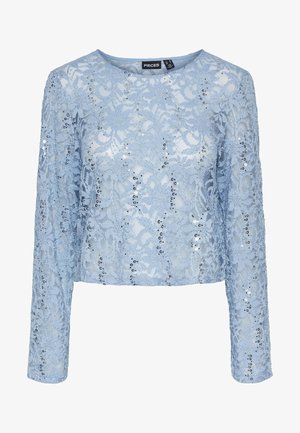 Jasnoniebieska koronkowa bluzka z długimi rękawami, z akcentami z cekinów i okrągłym dekoltem. Skrojona w skróconej sylwetce, aby uzyskać dopasowany wygląd.