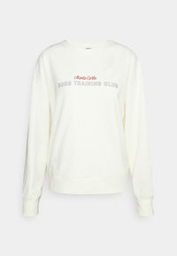 Sweatshirt bianco con collo a giro e maniche lunghe, con il testo "Monte Carlo BORG TRAINING CLUB" sul petto in lettere rosse e grigie.