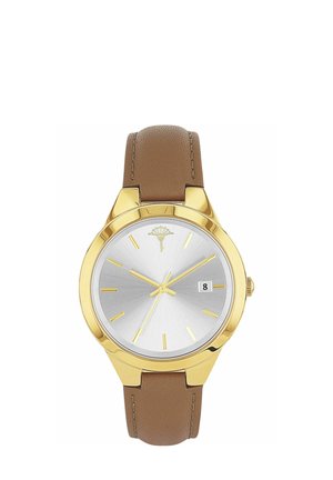 Gold-tone analog watch with silver dial, gold hour markers, brown leather strap, and date display showing the 8th.