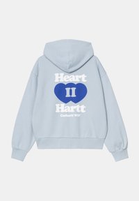 Felpa azzurra con una vestibilità rilassata, caratterizzata da una grande grafica di un cuore blu e da un testo bianco audace sulla parte posteriore. Tessuto morbido, polsini a coste.