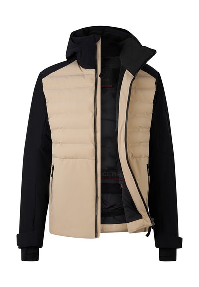 Beige en zwartejas met een gewatteerde voorkant, capuchon, ritszakken en elastische manchetten. Het interieur heeft een donkere voering en labeldetails.