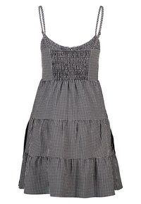 Black and white gingham dress with smocked bodice, thin straps, and ruffled hemline. Features side pockets and lightweight fabric.