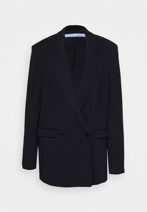 Sort dobbeltknappet blazer med hakindsnit på reverset, to knapper og klaplommer, vist mod en ensartet hvid baggrund.