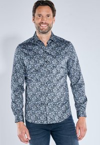 Langarmhemd in Dunkelblau mit blumenmuster in Hellblau und Weiß. Verfügt über einen Button-Down-Kragen und einen regulären Schnitt. Glatte Stofftextur.